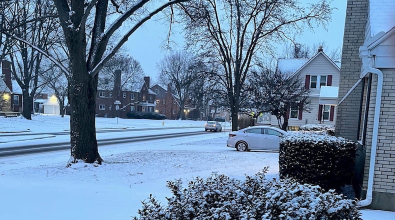 Light snow was falling Friday evening, Jan. 28, 2022, on Shroyer Road in Oakwood.