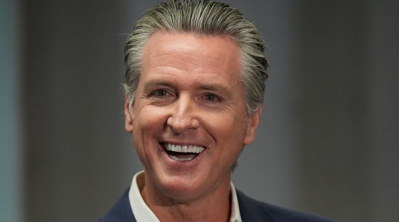 California Gov. Gavin Newsom smiles after signing legislation related to student literacy in Los Angeles on Thursday, Oct. 9, 2025. (AP Photo/Damian Dovarganes)