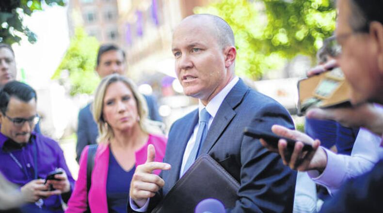 Joshua Stueve, Dayton native and a public affairs officer with the U.S. Department of Justice U.S. Attorney’s Office, speaks outside the federal courthouse in Alexandria, Va., in October 2019. AP Photo/Pablo Martinez Monsivais
