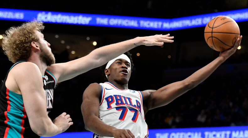 Philadelphia 76ers guard VJ Edgecombe (77) shoots against Memphis Grizzlies center Jock Landale in the second half of an NBA basketball game Tuesday, Dec. 30, 2025, in Memphis, Tenn. (AP Photo/Brandon Dill)