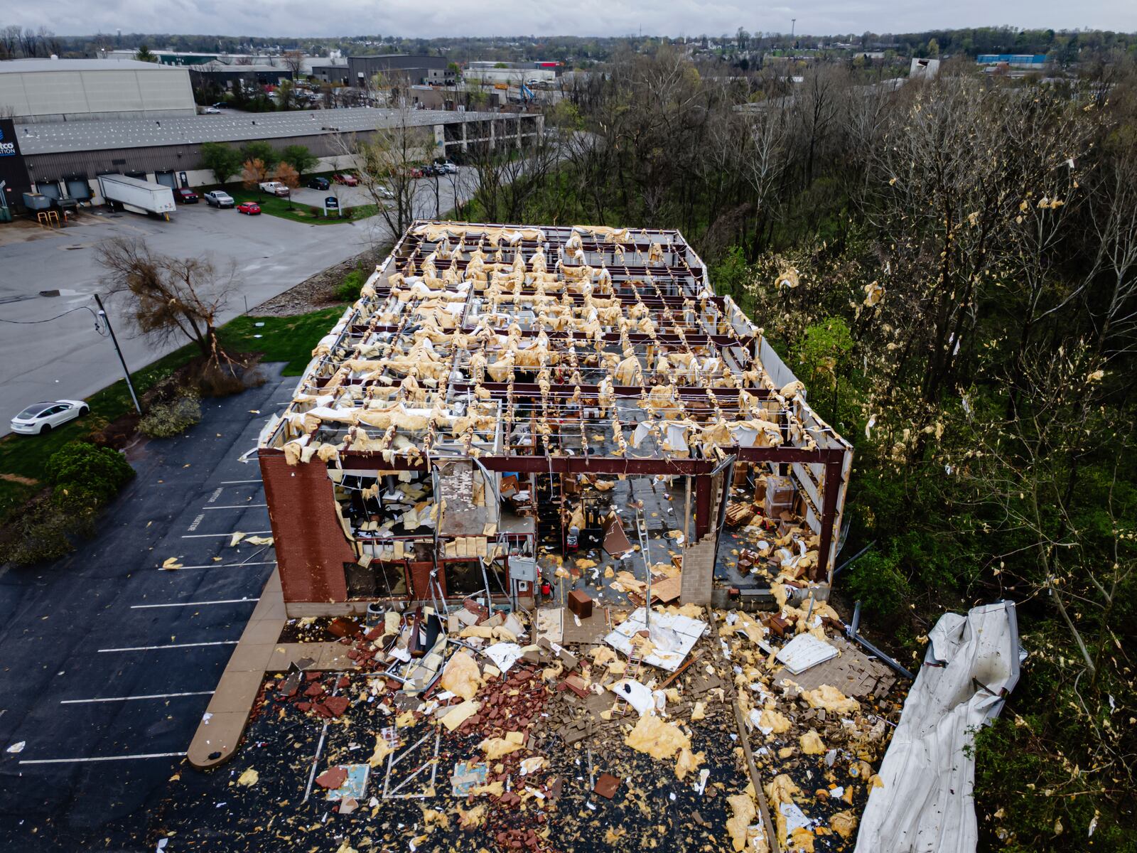 This aerial view shows the damaged Specialty Distributors building is seen after a tornado passed through an industrial industrial park on Thursday, April 3, 2025, in Jeffersontown, Ky. (AP Photo/Jon Cherry)