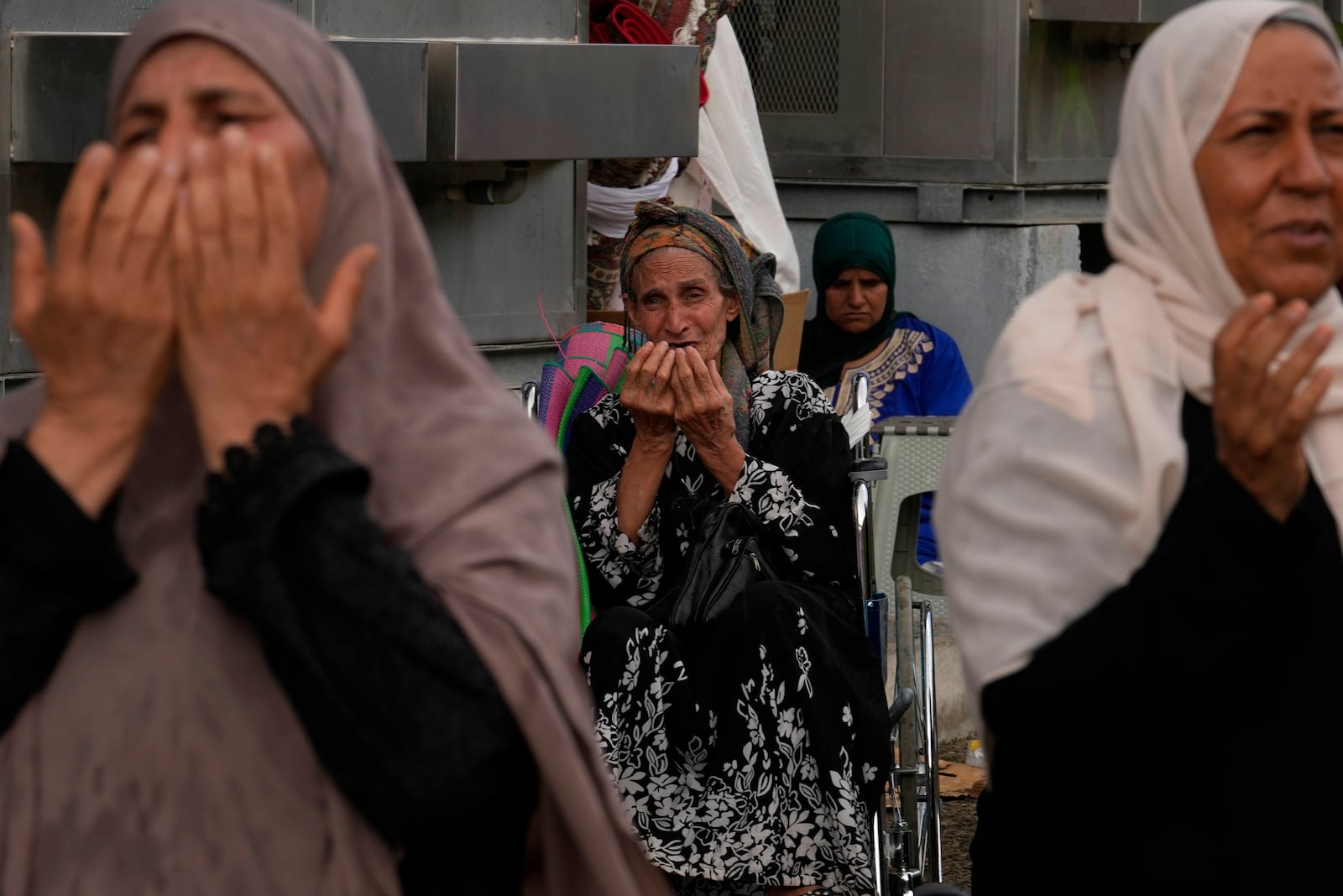 FILE - Muslim pilgrims pray after casting stones at pillars in the symbolic stoning of the devil during the annual hajj, as it rains in Mina, near the holy city of Mecca, Saudi Arabia, Monday, June 17, 2024. (AP Photo/Rafiq Maqbool, File)