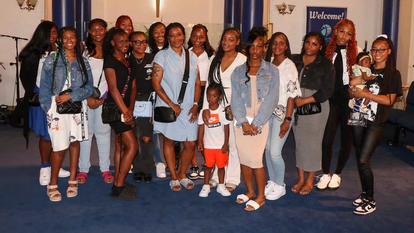 Dunbar coach Juanida Hurt poses for a photo with her cheerleading squad at a recent bonding event at Revival Christian Ministries in Dayton. CONTRIBUTED PHOTO