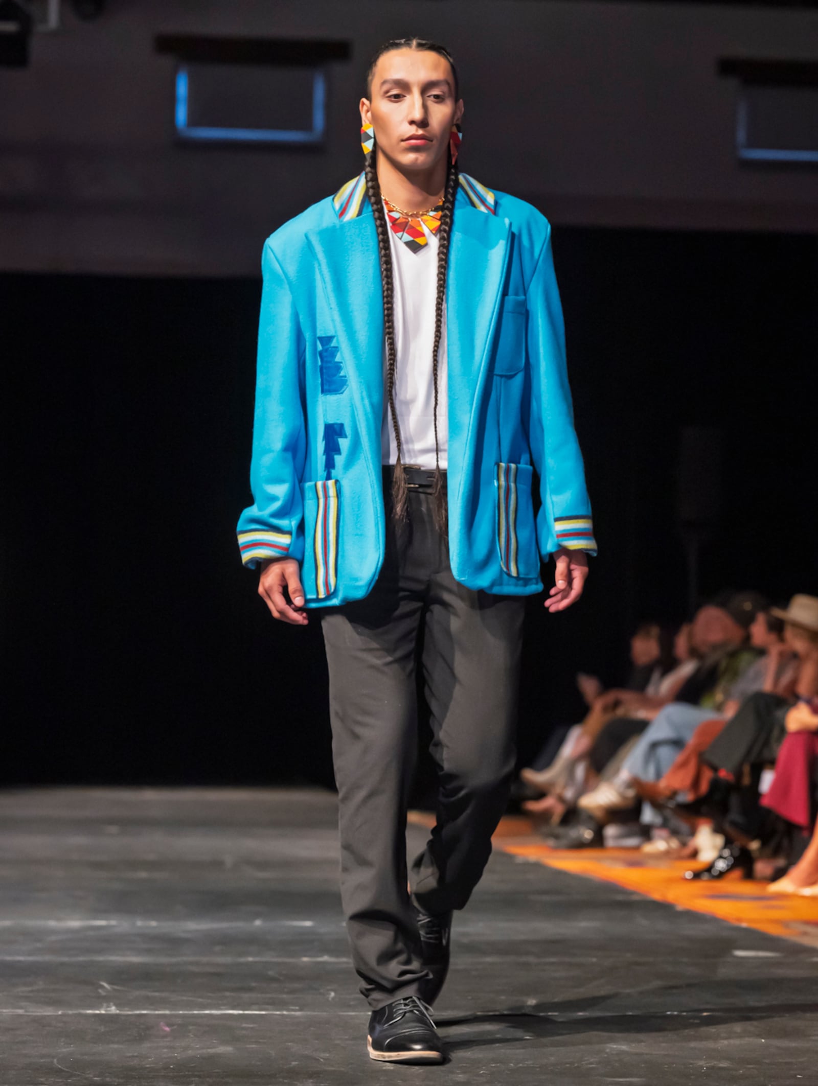 A model wears a design by Sage Mountainflower on the runway at the 2025 Native Fashion Show, Friday, May 9, 2025, in Santa Fe, N.M. (AP Photo/Roberto E. Rosales)