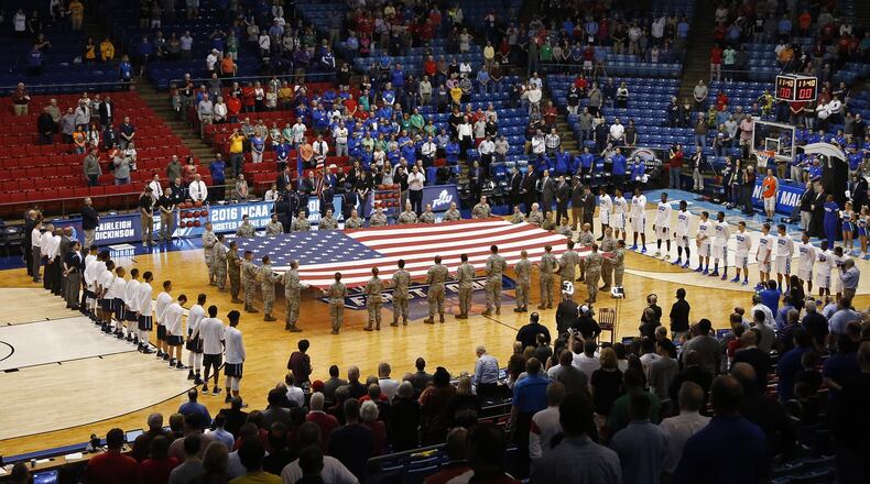 Airmen from Wright-Patterson Air Force Base presented the colors before the start of the NCAA First Four at UD Arena. TY GREENLEES / STAFF