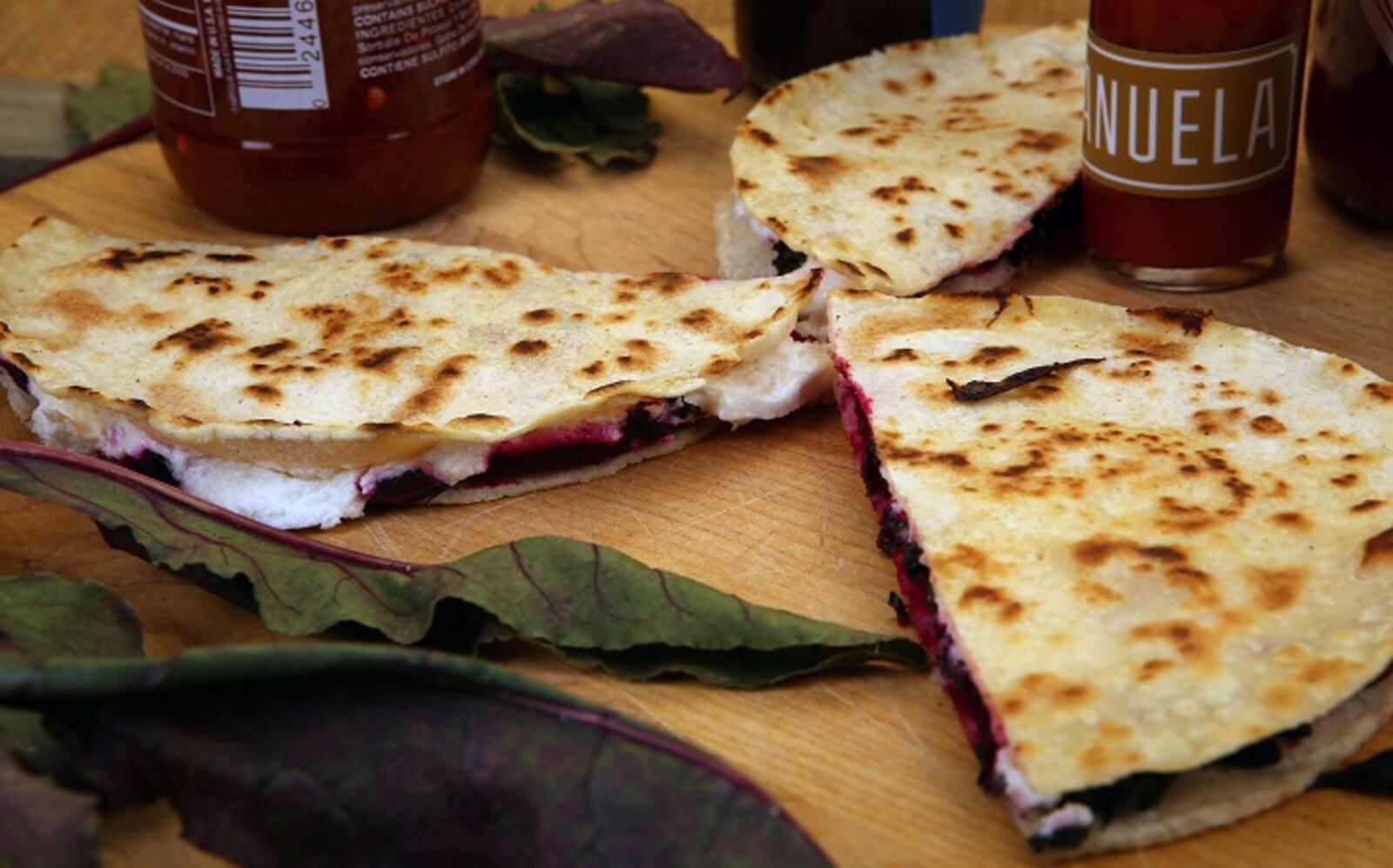 Beet green, roasted beets and goat cheese quesadillas. (Glenn Koenig/Los Angeles Times/TNS)
