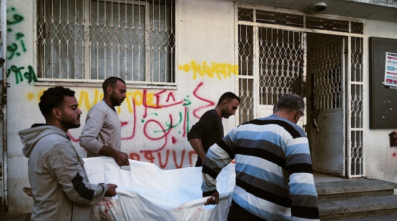 The body of 11-year-old Palestinian girl Hamsa Hosou, killed by Israeli fire in Jabalia, is brought to Shifa Hospital in Gaza City Thursday, Jan. 8, 2026. (AP Photo/Jehad Alshrafi)