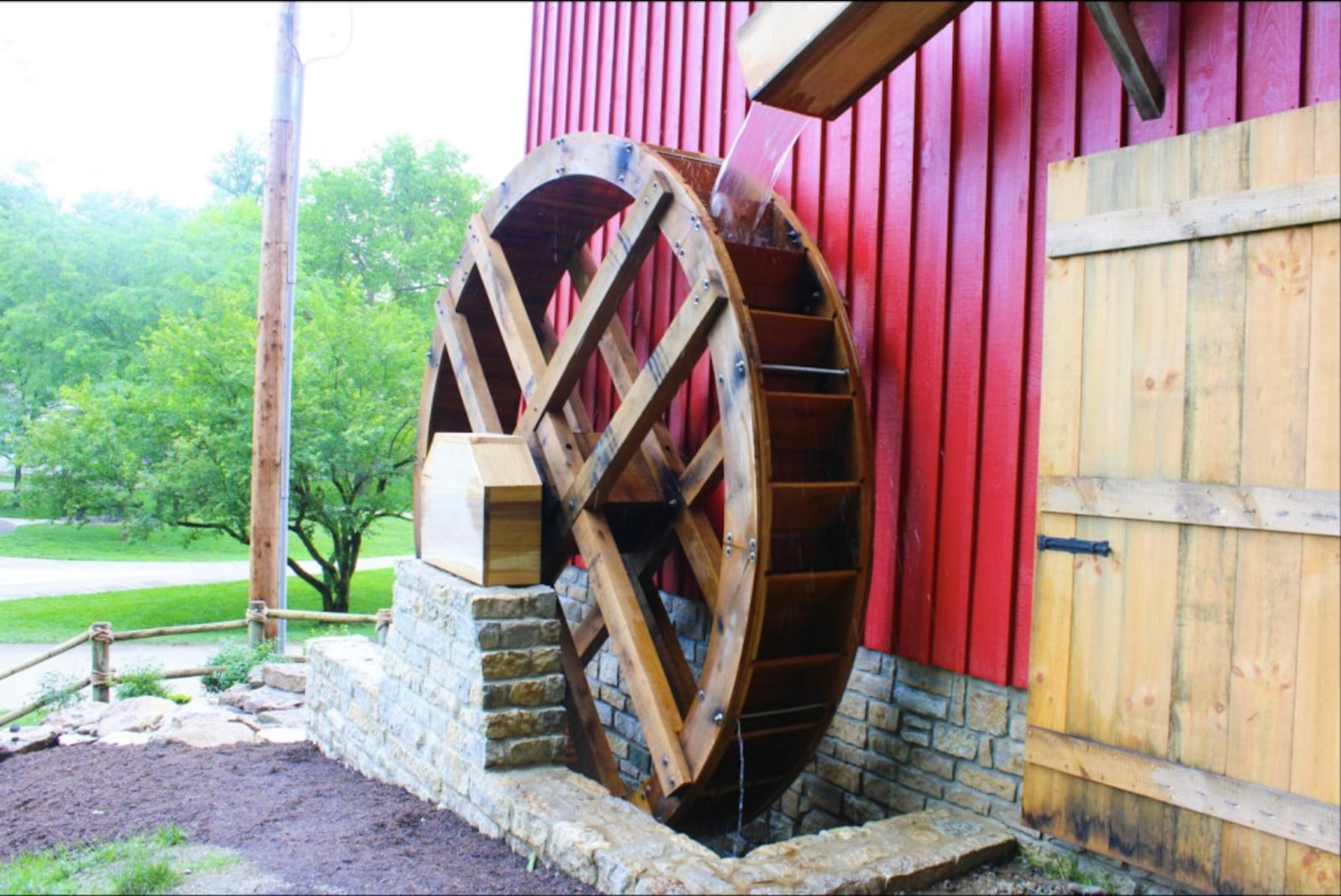 A 12-foot timber-framed water wheel is a main attraction of the Mad River Pulp & Paper exhibit at Carillon Historical Park. CONTRIBUTED
