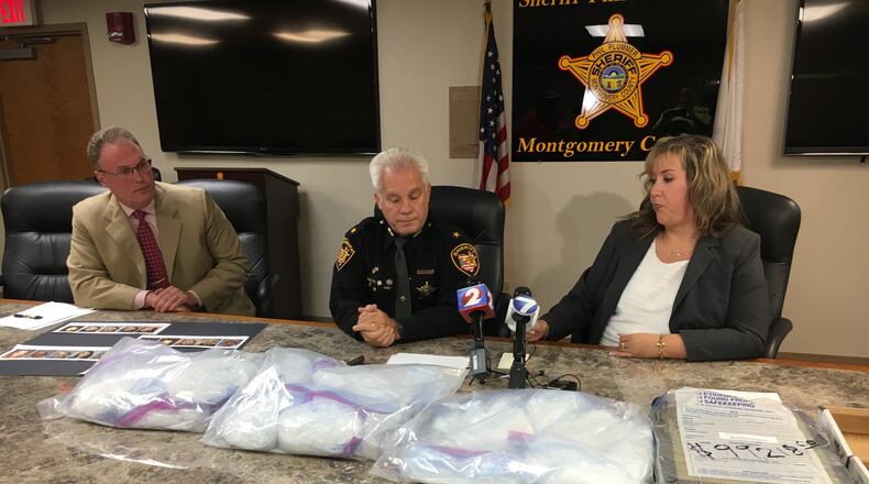 Montgomery County officials held a press conference Thursday to announce a large methamphetamine bust. Seated (from left) are Coroner Kent Harshbarger, Sheriff Phil Plummer and Jail Treatment Coordinator Teresa Russell. STEVE MAGUIRE/STAFF