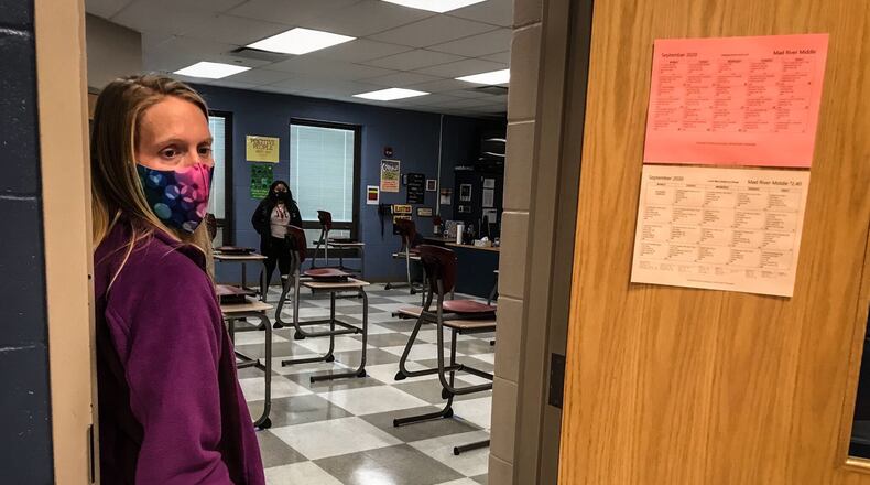 Mad River Middle School teacher, Jessica Godsey welcomes her students back to school. Montgomery County commissioners approved Tuesday an $800,000 coronavirus relief grant for Mad River Local School District. JIM NOELKER / STAFF
