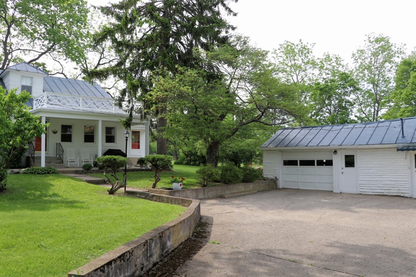 The outbuilding has an oversized one-car garage, finished office space and additional storage space.