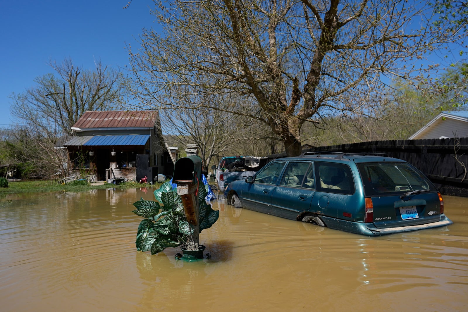FILE - A home is flooded by the Kentucky River, Lockport, Ky., Tuesday, April 8, 2025. (AP Photo/Carolyn Kaster, File)