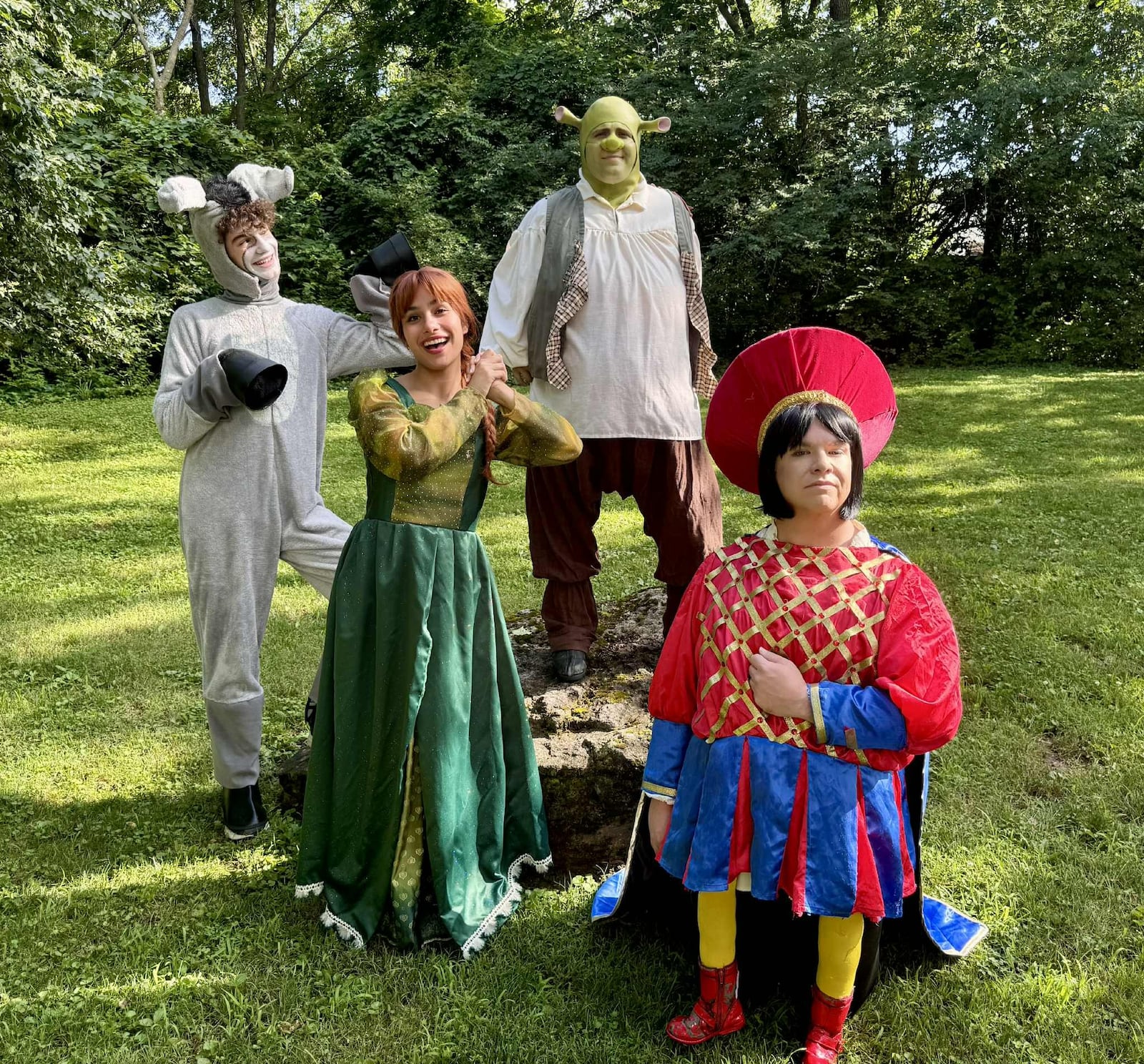 Left to right: Sully Crinion (Donkey), Sophia Harvey (Princess Fiona), TJ Montgomery (Shrek) and Nick Bellmyer (Lord Farquaad) appear in Epiphany Lutheran Church's production of "Shrek: The Musical." Photo by Megan Wean Sears