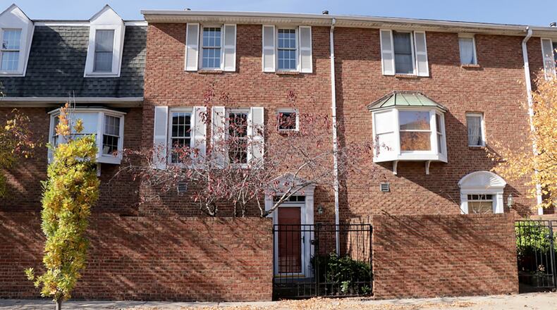 Formal entry to the 2-bedroom condo is tucked within a brick courtyard with wrought-iron gate entrance. The courtyard is accessible from sidewalks along Patterson Boulevard. CONTRIBUTED PHOTO BY KATHY TYLER