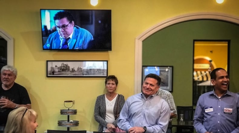 State Rep. Rick Perales, R-Beavercreek, (second from right) celebrates his apparent win in the Republican Primary for the Ohio 73rd district. Jim Noelker/STAFF