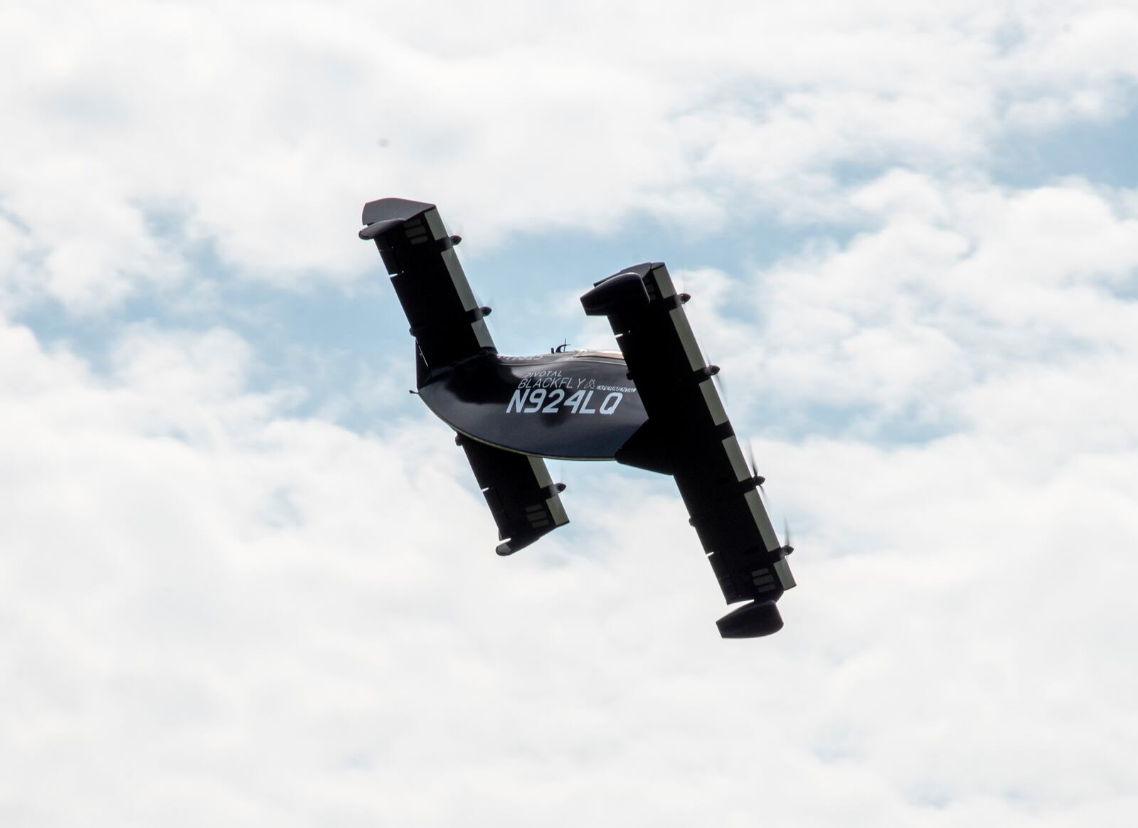 AFWERX, the Air Force’s innovation arm within the Air Force Research Laboratory, and Beavercreek-based defense contractor Modern Technology Solutions Inc. evaluate Pivotal’s BlackFly electric vertical take-off and landing aircraft at Springfield-Beckley Airport, Ohio, July 12, 2024.  (U.S. Air Force photo by Matthew Clouse).