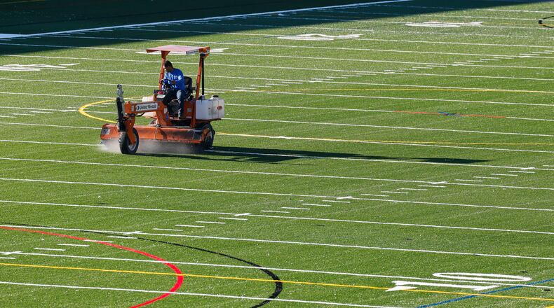 Crews work to install the turf playing field at Spooky Nook Sports Champion Mill Friday, Aug. 12, 2022 in Hamilton. NICK GRAHAM/STAFF