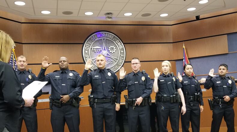 Seven Moraine Police Department patrol officers are sworn in Thursday, Aug. 26, 2021, during council's regularly scheduled meeting. The officers include (left to right)
Tyler Dennis, DaVaughn Richardson, Bryon Watson, Joseph Alexander, Sharmae Hatfield, Karen Arriaga-Perez, and Ali Al Gburi. CONTRIBUTED