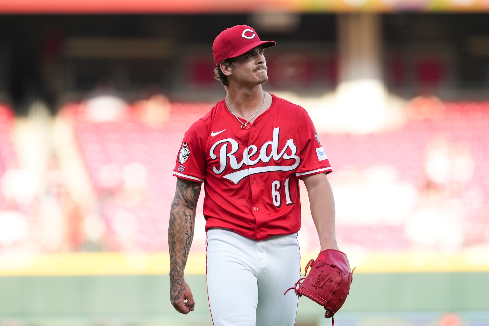 Cincinnati Reds pitcher Chase Petty walks to the dugout during the first inning of the second baseball game of a doubleheader against the St. Louis Cardinals, Wednesday, April 30, 2025, in Cincinnati. (AP Photo/Jeff Dean)