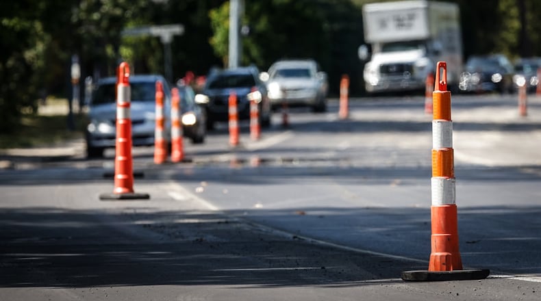 Drivers on Ohio 48 through Oakwood will deal with orange traffic cones as the Ohio Department of Transportation said the resurfacing project on Far Hills Avenue though the city may not be done until late September or early October. Jim Noelker/Staff