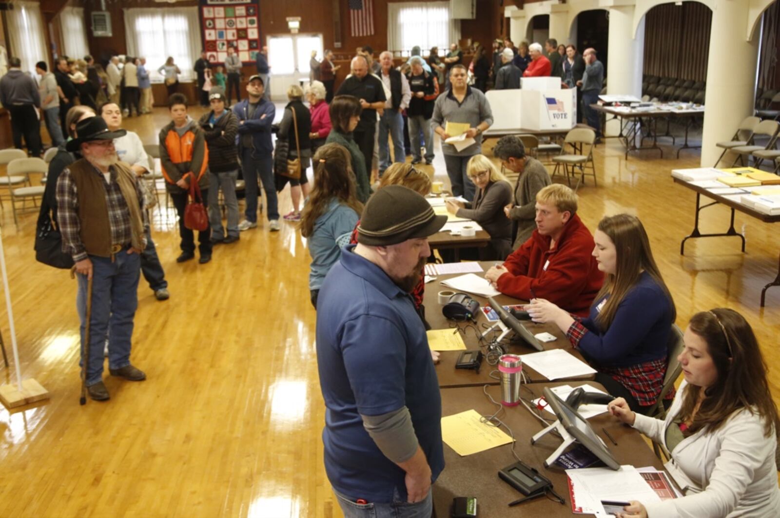 Voters at Community Golf Course in Kettering were met with a long line inside the polling place. Most voters reported waiting at least one hour to cast their ballots around noon. TY GREENLEES/ STAFF
