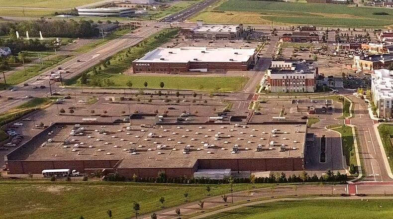 This aerial view shows part of two Joint Economic Development Districts Miami Twp. shares with area cities. Austin Landing, which is part of the Austin Center JEDD, is the dominant image in this photo. Part of the Dayton JEDD - the Dayton-Wright Brothers Airport - can be scene in the upper left part of the photos. TY GREENLEES / STAFF