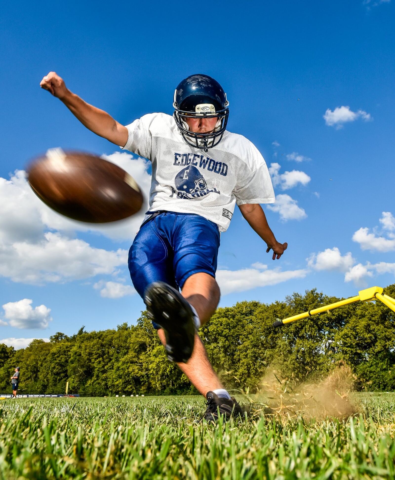 Edgewood High School senior Julian Pletz practices place-kicking Wednesday near the football stadium. Pletz also plays soccer for the Cougars. NICK GRAHAM/STAFF