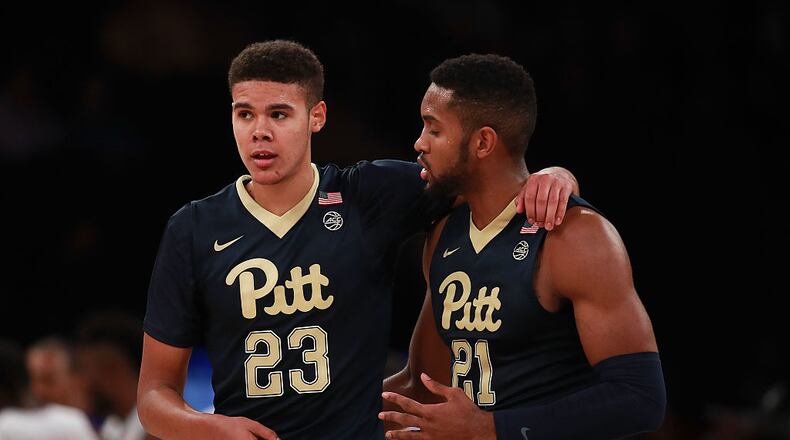 NEW YORK, NY - NOVEMBER 17: Cameron Johnson #23 and Sheldon Jeter #21 of the Pittsburgh Panthers talk against the Southern Methodist Mustangs in the first half during the 2K Classic at Madison Square Garden on November 17, 2016 in New York City. (Photo by Michael Reaves/Getty Images)