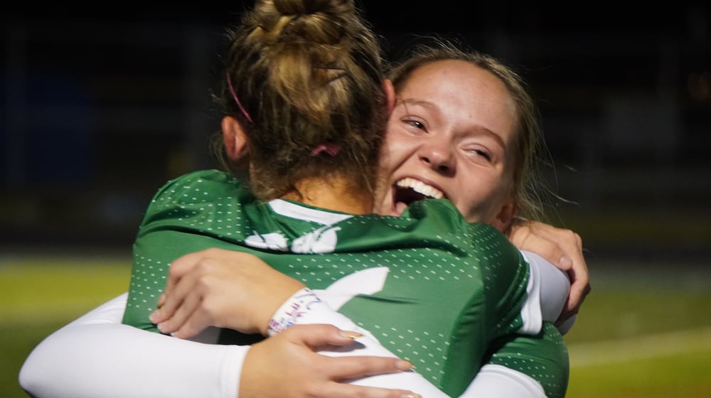Badin High School girls soccer sophomore Audrey Rhodis hugs senior teammate Braelyn Even after the Rams beat Hoban 1-0 in a Division III state semifinal match on Tuesday night at Olentangy. CHRIS VOGT / CONTRIBTED