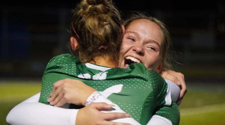 Badin High School girls soccer sophomore Audrey Rhodis hugs senior teammate Braelyn Even after the Rams beat Hoban 1-0 in a Division III state semifinal match on Tuesday night at Olentangy. CHRIS VOGT / CONTRIBTED