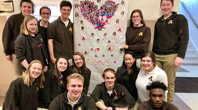 Alter High School ‘God Squad’ students proudly show off their room for a door decorating contest. Contributed photo