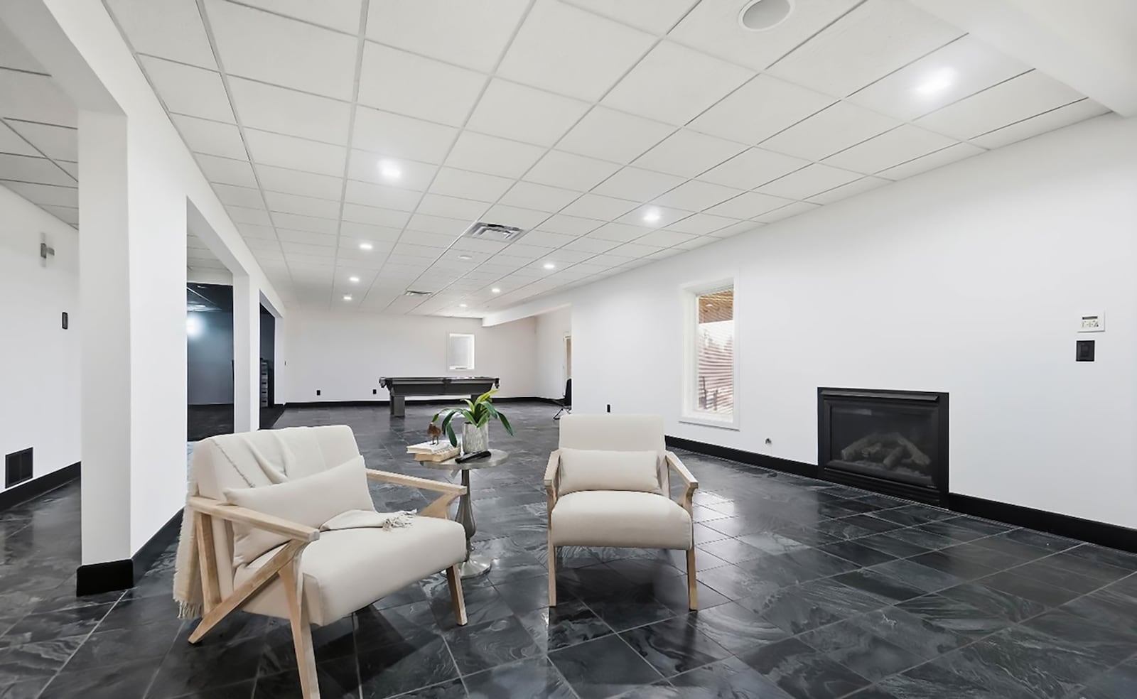 The finished walk out basement has a recreation room, theater room, exercise area, a 5th bedroom and a full bathroom. there is a fireplace in the recreation room. CONTRIBUTED