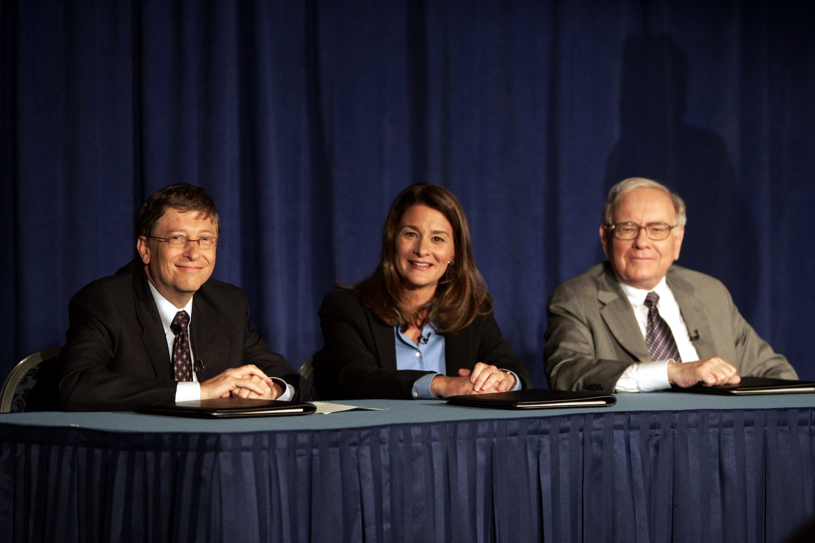 FILE - Bill Gates, Melinda Gates and Warren Buffett speak to the media during a press conference, June 26, 2006 in New York. (AP Photo/Seth Wenig, File)