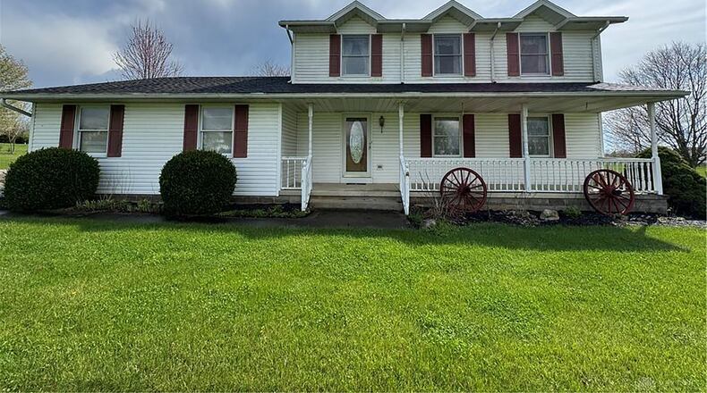 The front has a fully covered porch with railings and a two-car, attached garage with opener. CONTRIBUTED PHOTOS