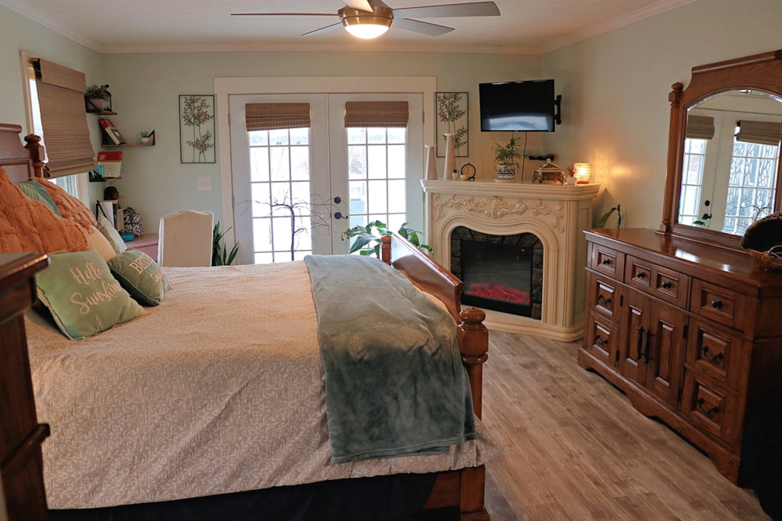 The primary bedroom has French doors that open to the backyard balcony deck. CONTRIBUTED BY KATHY TYLER