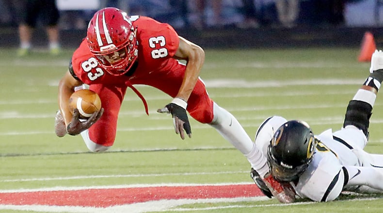 Fairfield tight end Erick All is tripped up by Centerville defensive back Dom Ramsey during Friday’s Skyline Chili Crosstown Showdown contest at Fairfield Stadium. The host Indians lost 30-23. CONTRIBUTED PHOTO BY E.L. HUBBARD