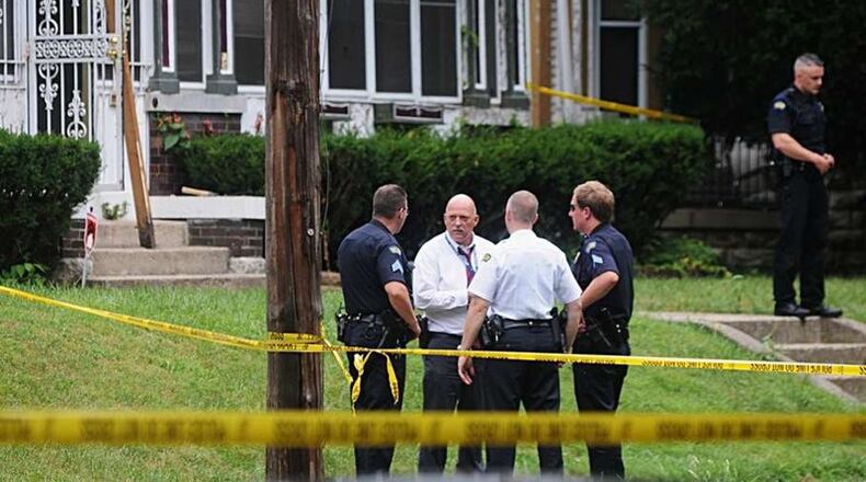 Dayton police investigate an unofficial total of 42 homicides in 2016, which matches a 16-year high. Here, officers were called to a triple homicide at 35 Oxford Ave. on Wednesday Aug. 10, 2016. Muhammad Shabazz Ali, 61, is accused of shooting to death Tammy Cox, 53, Michael D. Cox, 25, and Jasper Taylor, 74. MARSHALL GORBY / STAFF