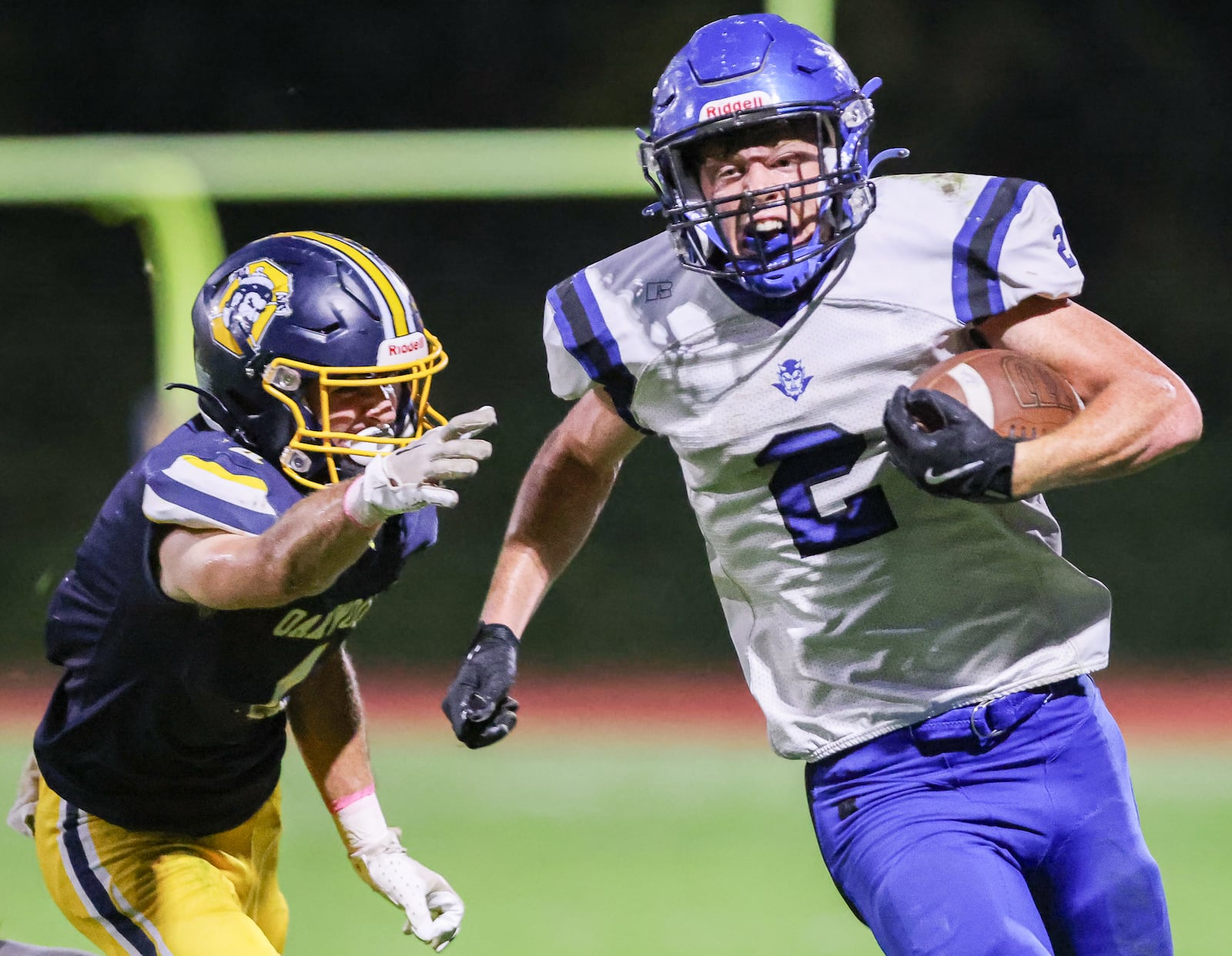 Brookville senior running back DJ Moore runs with pressure from Oakwood's Braden Devine during a Southwestern Buckeye League game on Friday, Oct. 3  at Mack Hummon Stadium. Moore scored two touchdowns in the first half of a 35-14 win. BRYANT BILLING / STAFF