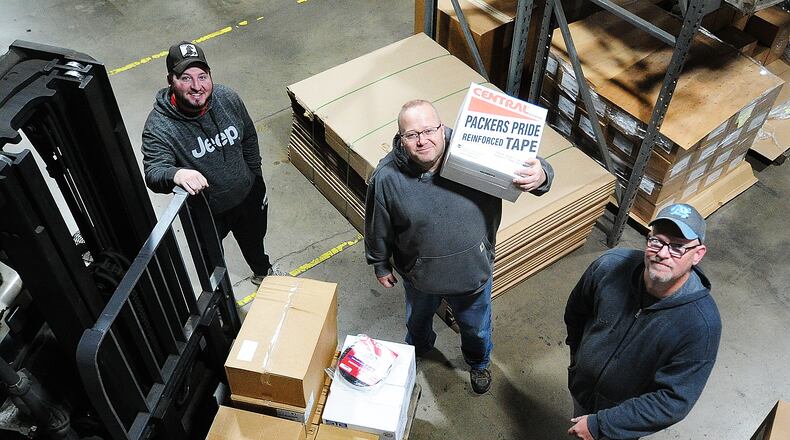 Allied Shipping & Packaging Supplies at 3681 Vance Road in Moraine recently celebrated 40 years in business, all of them in Moraine. Employees (from left to right) Chris Bradley, Donny Vanhoose and Eric Sine pause for a photo during work Wednesday, March 29, 2023. MARSHALL GORBY/STAFF