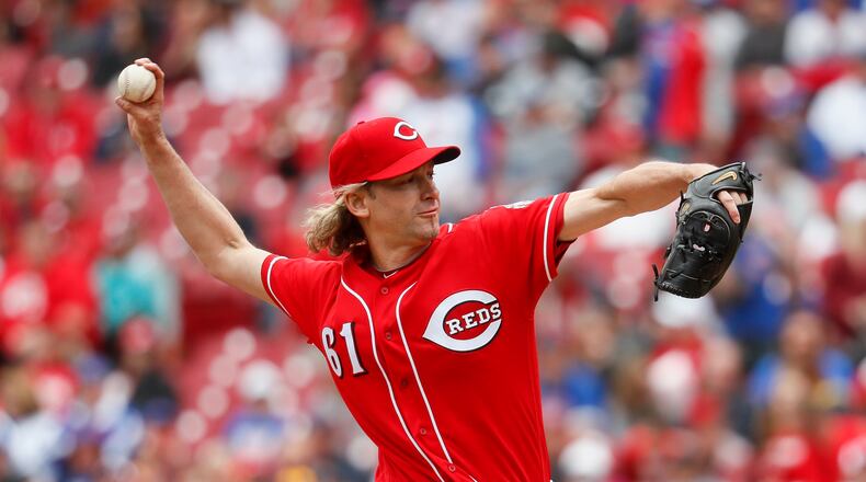Cincinnati Reds starting pitcher Bronson Arroyo throws in the first inning of a baseball game against the Chicago Cubs, Sunday, April 23, 2017, in Cincinnati. (AP Photo/John Minchillo)