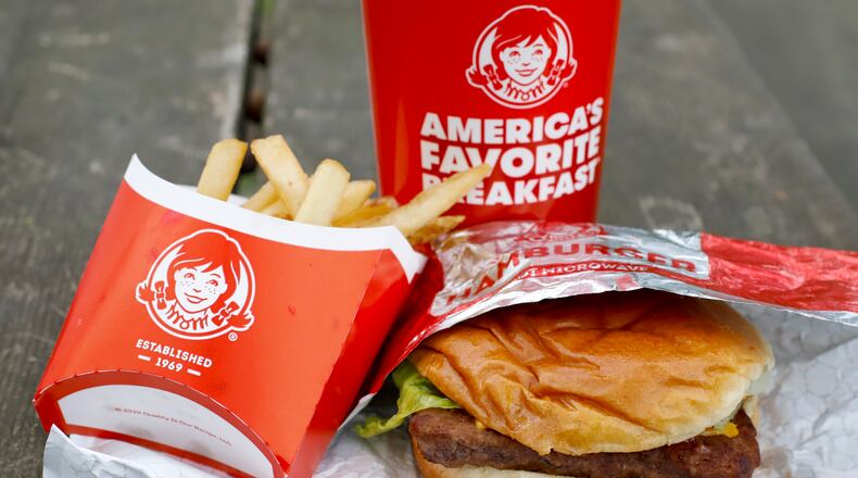 FILE - In this May 5, 2020, file photo, Wendy's restaurant Dave's Combo cheeseburger meal is displayed in Pittsburgh. Wendy’s plans to open 700 delivery-only kitchens by 2025 to meet the growing demand from people who want their fast food brought to them. The kitchens will primarily operate in urban neighborhoods in the U.S., Canada and the United Kingdom, the company said. (AP Photo/Gene J. Puskar, File)