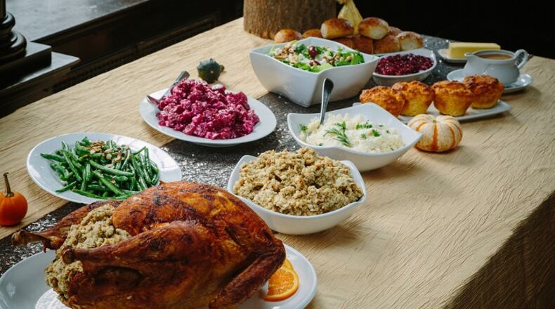 Each and every item needs to stand out when setting a Thanksgiving table. (Place settings are by Mansions on Fifth; linens are from Mosaic; and food is by Settlers Ridge Giant Eagle Market District.) (Andrew Rush/Pittsburgh Post-Gazette/TNS)