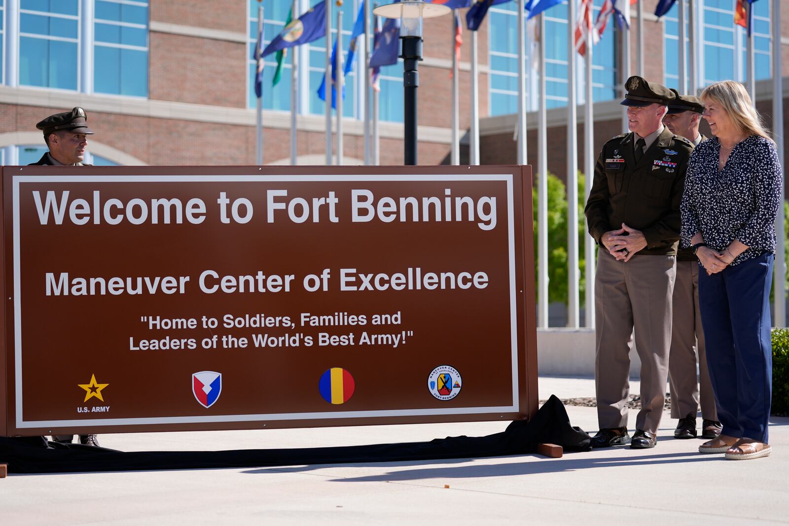 Ms. Sue Conger-Williams, right, Fred Benning's granddaughter unveils a new sign at Fort Benning during a ceremony honoring new namesake on Wednesday, April 16, 2025, in Fort Benning, Ga. (AP Photo/Brynn Anderson)