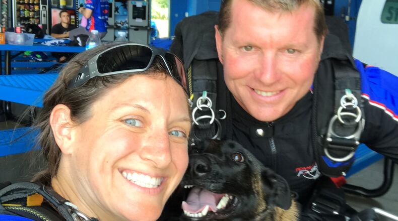 Nicole Condrey (l), mayor of Middletown and professional skydiver, with her husband Ron and his service dog, Via. Ron died by suicide in 2018, shortly after the couple moved to the area. SUBMITTED