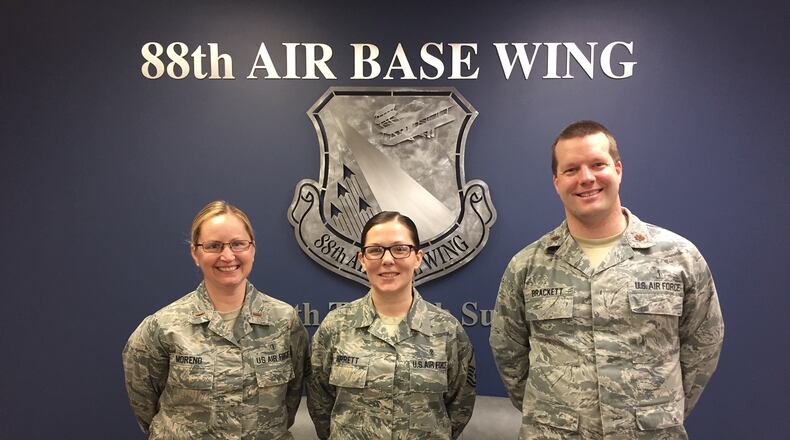 2nd Lt. Autumn Moreno, Master Sgt. Anna Garrett and Maj. Todd Brackett, left to right, are coordinating the 46th annual Air Force Assistance Fund campaign at Wright-Patterson Air Force Base. Moreno received assistance from the Air Force Aid Society when she was a young Airman and suddenly needed a plane ticket to get home after a family member died. (Skywrighter photo/Amy Rollins)