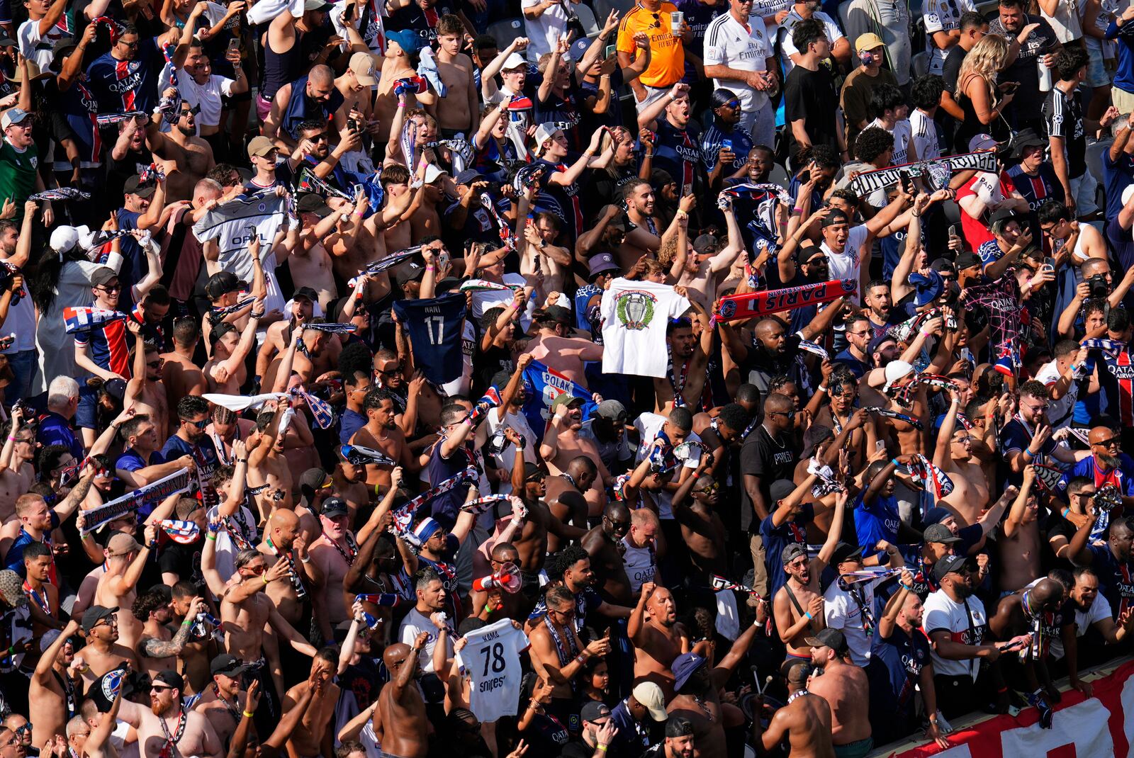 Paris Saint-Germain fans cheer after Goncalo Ramos scored during the Club World Cup semifinal soccer match between PSG and Real Madrid in East Rutherford, N.J., Wednesday, July 9, 2025. (AP Photo/Pamela Smith)
