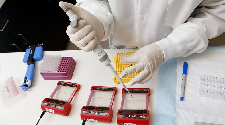 Melanie Sucevic works in the laboratories at AssureRx in 2012 in Mason. Assurex Health will expand for a third time in Mason, relocating its offices to a new location along Interstate 71. STAFF FILE PHOTO