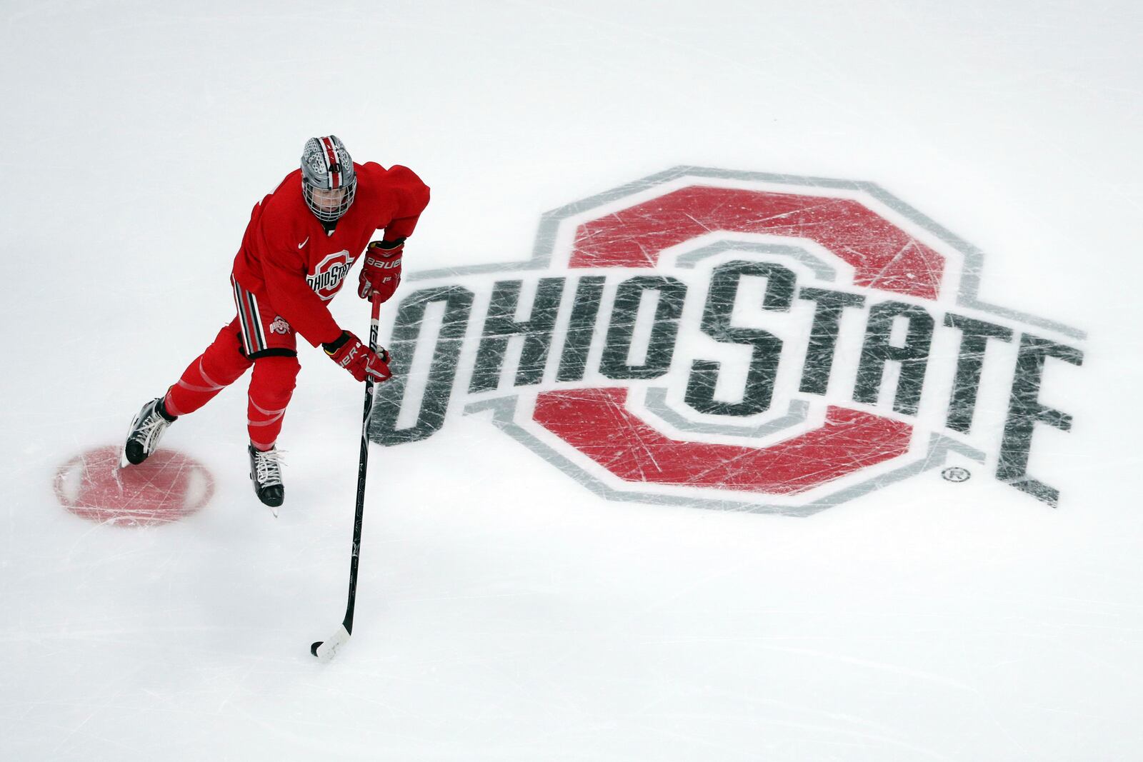 FILE - Ohio State University forward Ronnie Hein guides the puck during NCAA college hockey practice on April 4, 2018, in St. Paul. Minn. Three years into the new age of college sports, where athletes are allowed to profit from their successes through name, image and likeness deals, everyone is still trying to find out what the new normal will be. (Anthony Souffle/Star Tribune via AP, File)