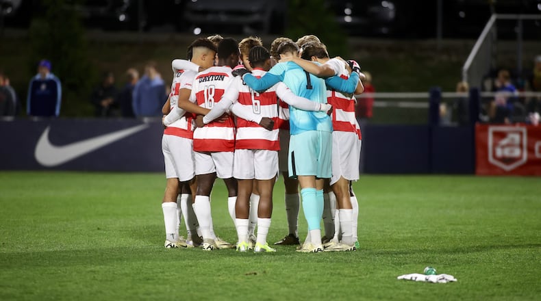 Dayton huddles before a game against Davidson in the quarterfinals of the A-10 tournament on Friday, Nov. 8, 2024, at Baujan Field in Dayton. David Jablonski/Staff