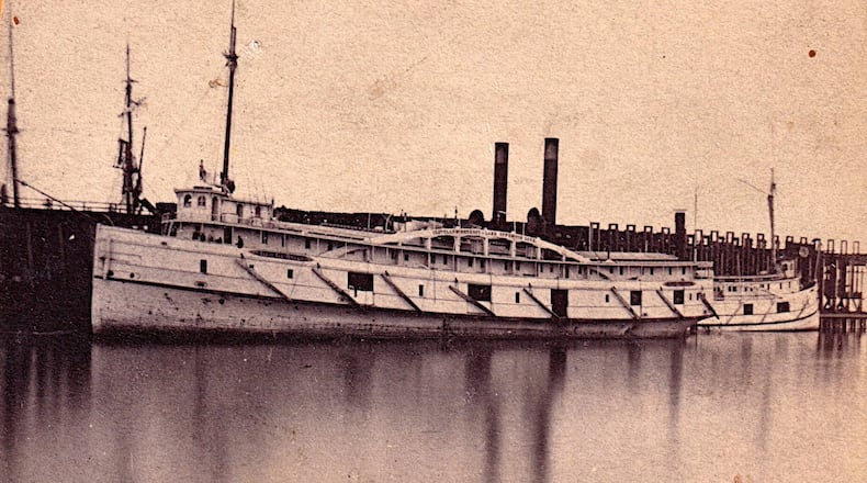 This image of an original photo print provided by Brendon Baillod shows the Lac La Belle docked at Marquette, Mich., in 1866. (Brendon Baillod via AP)